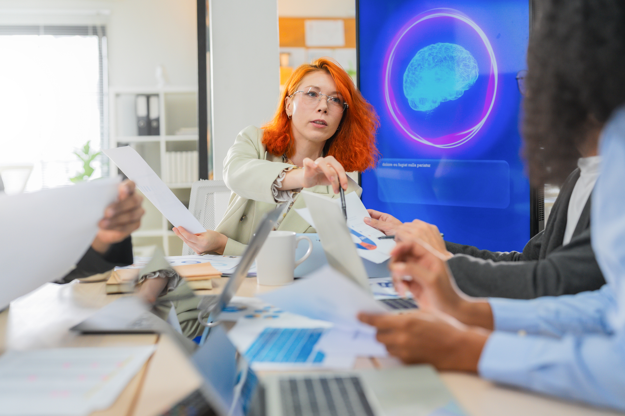 Business professional concentrates in coworking space leveraging AI powered virtual assistant and realtime big data analytics on laptop display for hyper automated workflow intelligence optimization